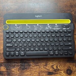 Logitech Keyboard with Black Keys and Yellow Accent